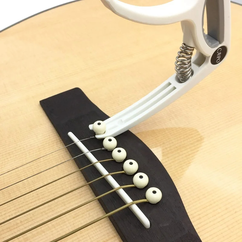 Capotasto per chitarra in plas - Musical Instrument With Strings recensione e prezzo
